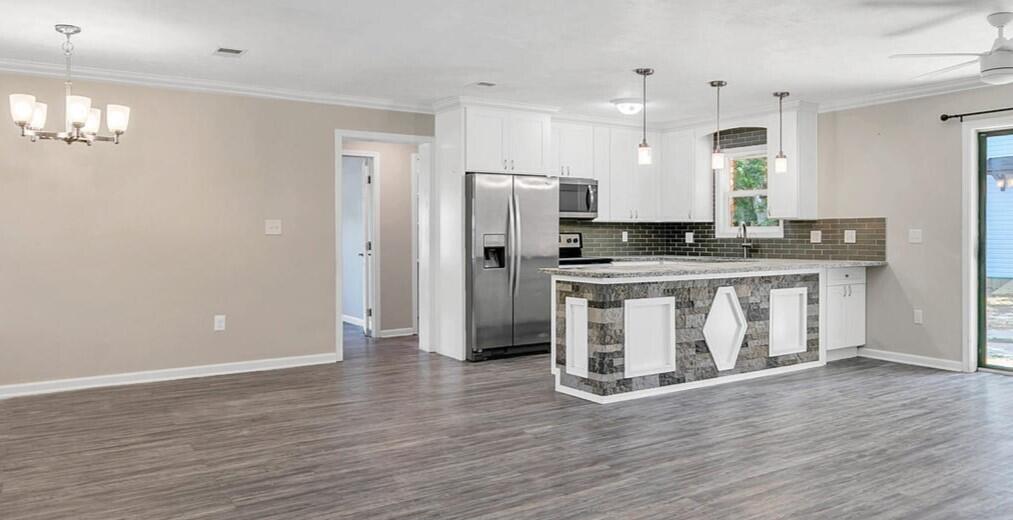 CHECK OUT ALL OF THESE UPGRADES! New roof & HVAC system 2024. This home offers many upgrades including remodeled kitchen with granite countertops, stainless steel appliances, cabinets and tiled backsplash. Remodeled bathrooms with granite and tiled baths. Luxury vinyl plank flooring throughout, upgraded electrical wiring and natural gas water heater. Privacy fenced backyard with bonus 11.5' X 15' spacious workshop, art studio or storage building with vaulted ceiling. This home is located in a low traffic sought after neighborhood convenient to schools, FWB Recreation Center, military bases, beaches, shopping, restaurants, Fort Walton Yacht Club, entertainment and so much more. Move in ready! Make your easy appointment to see today!