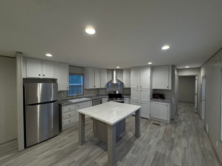 Welcome to this charming manufactured home on a spacious 0.22-acre lot with plenty of room to stretch out and relax. Featuring 3 bedrooms, 2 bathrooms, and a bright, open layout, this home offers comfort and functionality. Step outside and enjoy the large backyard ,pets, gardening, or entertaining. The 8-foot privacy fence not only adds security but also ensures peace and quiet -- because as they say, good fences make great neighbors! Whether you're looking for your first home or an investment opportunity, this property is move-in ready and waiting for its next owner.