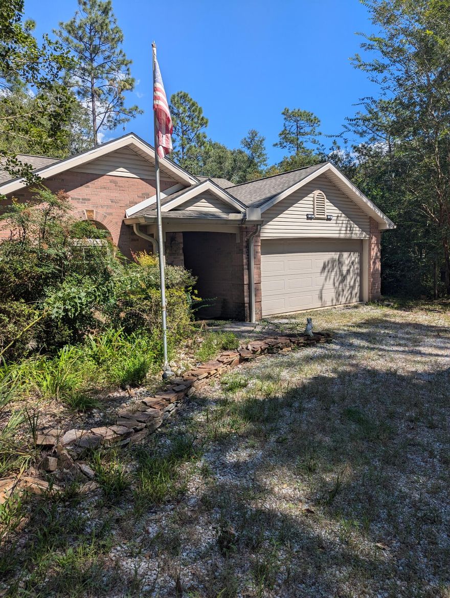 This home sits on 1.83 acres in Retreat Inlet~ 3 bedrooms, 2 bathrooms, 2 car garage~ This has 2 outbuildings and a gazebo~ Beautiful shrubs, flower beds and trees~ Just minutes from town~ Community gazebo for family gatherings and boat ramp to Yellow River for fishing~