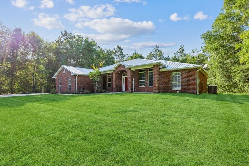 Fully updated move-in ready home with 1 acre. Within the last 18 months, this home has had a new roof, HVAC, gutters, updated cabinets, granite counters, stainless-steel appliances, added travertine shower in the master bath, vanities, waterproof LVP throughout the home, driveway with extended parking, lighting throughout the home, water cutoffs, and new faucets. It is easy to fall in love with the kitchen with beautiful dark cabinets, black granite and brushed nickel pulls along with the nice-sized island and pantry will make any chef happy. The kitchen is open to the large living room and dining room. The large master suite is a dream. The master bathroom has separate shower and jetted tub. Two bedrooms have custom paint perfect for kids or an office. Schedule your showing today.