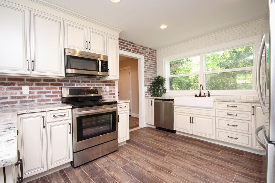 Effective age 2016! Gorgeous 4 bedroom, 3 and 1/2 bathroom home. Beautifully rehabbed from top to bottom. Everything is new! New roof, new HVAC, new sprinkler system and all new sod, new lighting, new ceiling fans, new paint, new doors, new flooring, new upgraded faucets, new remodeled kitchen with upgraded granite, all new stainless appliances and stunning kitchen cabinets. The oversized master bedroom and bathroom are stunning. So many details in this amazing home. MUST SEE! Owner is a licensed real estate broker.