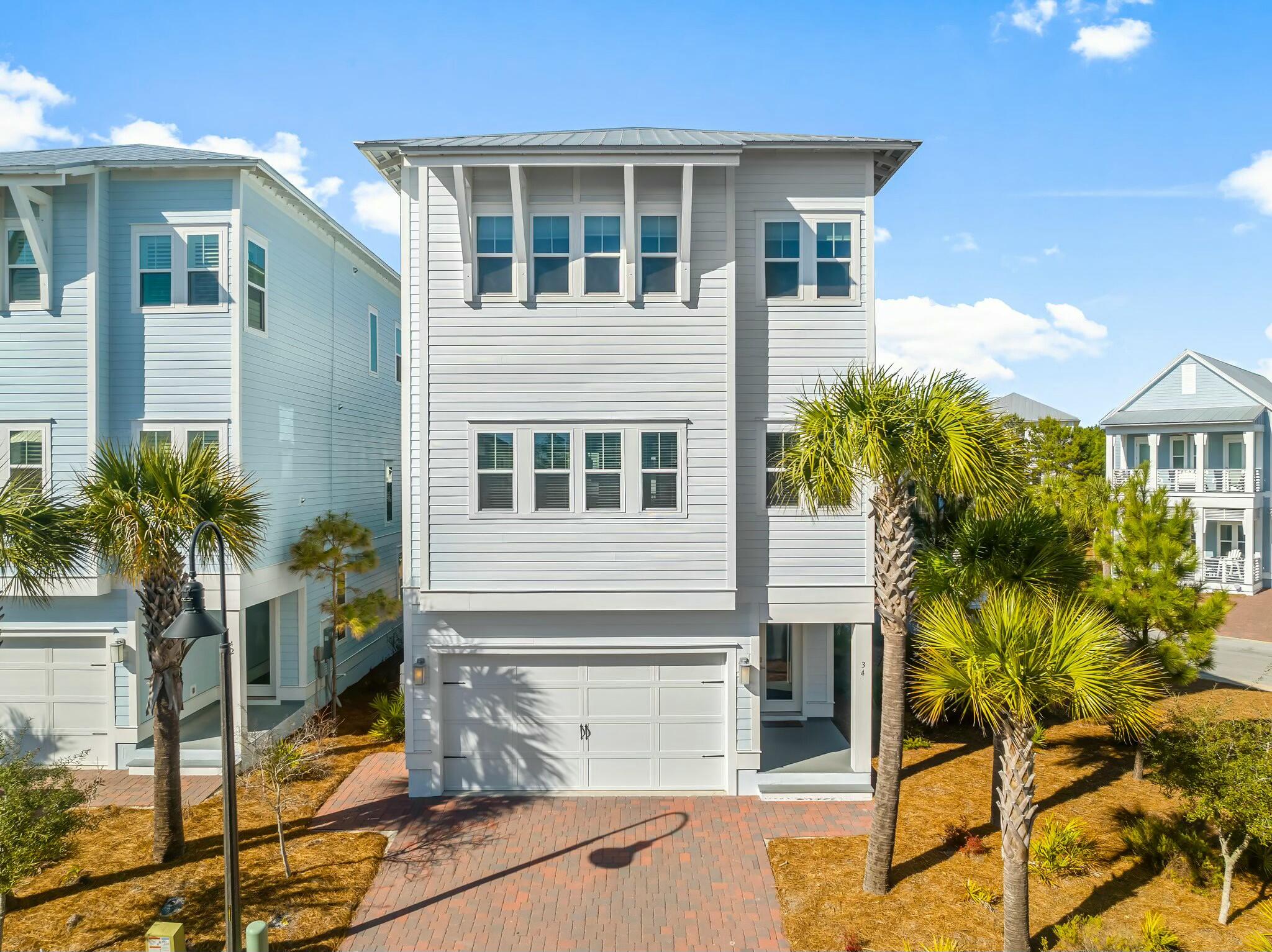 Welcome to this beautiful home located on the sought-after Southside of Prominence, offering privacy and comfort on a spacious corner lot. This home features an oversized bedroom on the first floor that provides endless possibilities--whether you envision it as a yoga studio, playroom, office, or any space that fits your lifestyle.Convenience is key with an elevator that makes accessing each level a breeze, as well as a two-car garage for all your storage needs. Each floor boasts its own porch, with the first-floor porch perfect for outdoor dining and relaxation with an included barbecue. The second-floor porch, just off the dining room, is screened-in for a bug-free experience, allowing you to enjoy the fresh air year-round.Built in 2020, this home comes fully furnished, allowing you to move right in and start enjoying its many amenities. Prominence is ideally located on the east end of 30A, with easy access to The Big Chill, a popular destination offering shopping, dining, and entertainment for all ages. The Watersound Beach Club is just a short walk away for members, providing even more luxury and convenience at your fingertips. Additionally, the Prominence community features a community pool, offering a great place to relax and cool off on warm days.
This exceptional home is perfect for those looking for a tranquil, yet vibrant lifestyle in a prime location. Don't miss the chance to call it yours reach out to the listing agent today for more details and to schedule a showing!
