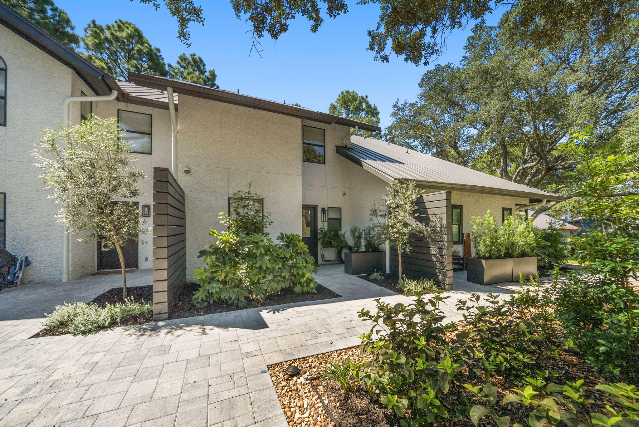 Tucked away among the shaded oaks of Seagrove and located South of 30A, this beautifully updated 2-bedroom, 2.5-bathroom townhome is a rare find. Whether you're searching for a primary residence, a vacation beach retreat, or a savvy investment, this property checks all the boxes.Step inside and discover a thoughtfully designed interior with stylish finishes and a bright, airy feel. The spacious screened-in porch invites you to enjoy morning coffee or evening cocktails while overlooking the tranquil surroundings. For water lovers, the private boat dock offers a peaceful spot to relax by the lake.With a generous amount of storage under deck or on the third floor attic -- you'll have space for all your beach gear and more. This ideal location puts you just a short stroll from two public beach accesses and within an easy bike ride to Seaside (3 miles West) or Rosemary Beach (4 miles East). Offering both privacy and proximity, this lakeside oasis delivers the perfect balance of serenity and coastal adventure.