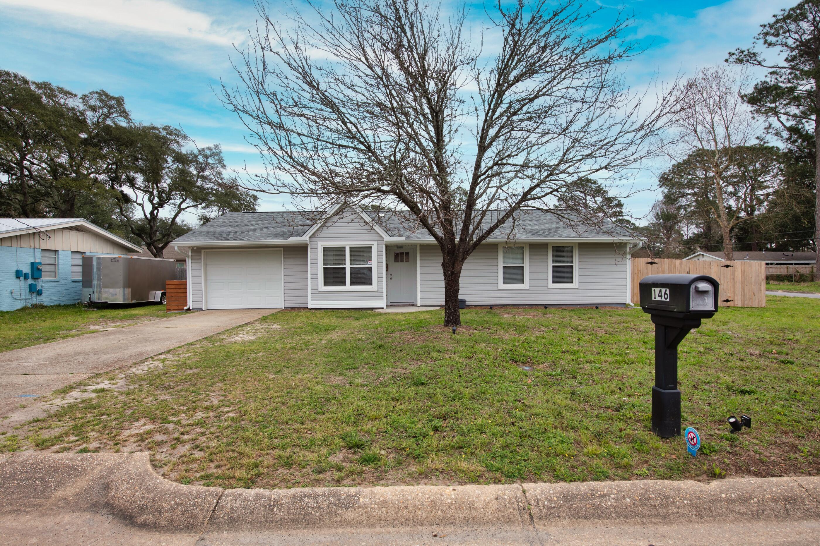 Great location!! Close to schools, shopping restaurants and minutes to the beach. This 3 bed/2 bath home has had several recent upgrades made to it. Sellers had new gutters and a 6ft privacy fence w/ a double gate installed this year. A 2 ton cooling system air conditioner, air duct replacement and a new roof, all installed in 2022. CoreLuxe Rigid Vinyl Flooring throughout the home, new Whirlpool Stainless Steel appliances; updated bathroom vanities, tubs and toilets; fiberglass front & back doors; recessed LED lighting w/dimmers and a new garage door opener/system. Out back there is an 11' x 30' deck, great for entertaining. Don't miss out on this great home!