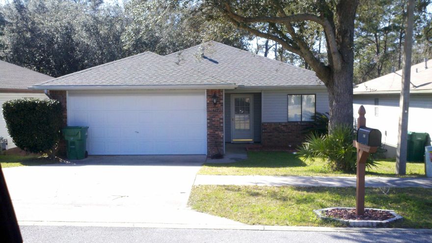 Cedar Ridge Charmer located in the heart of Niceville within walking distance to the community center, park and library. Wonderful floorplan with the great room open to the kitchen via a convenient pass through. The great room has cathedral ceilings and double sliding doors opening to a raised deck that overlooks the fully fenced yard and natural area behind it. The eat-in kitchen is light and bright with plenty of counter space and cabinets. The split plan features the master suite on one side of the home and another bedroom and full bath on the other. Both of the bedrooms have large walk-in closets as well. There is a two car garage that provides plenty of parking and storage and the low maintenance brick and vinyl exterior of thehome is truly a plus as well!