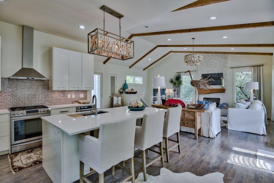 This charming, gated coastal dune lake neighborhood sits on Western Lake in Grayton Beach boasting a wonderfully-renovated cottage on the waterfront. The neighborhood is rental-restricted for a minimum of 6 months making for a peaceful, serene residence as a primary or second home. The lake-frontage shows off a white sand beach at water's edge. A lovely community pool and dock on Western Lake are a short stroll away! And, there's room on the large lot for a garage & carriage house. Second floor living with a 3rd story outdoor tower to enjoy the Gulf breezes! Beautiful renovation on Grayton waterfront cottage under $1M...rare find!! All bedrooms are on first floor with outdoor sitting areas.