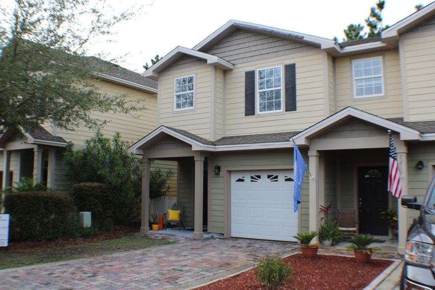 Fabulous Completely Renovated Unit with Brand New High End Stainless Appliances, New Lighting, Bathrooms and Fresh new Flooring.  Comes Complete with Washer and Dryer.  Move In ready, no expense was spared on the renovations.  Established community that includes a community pool and Gym! This particular unit is an End Unit backing up to a wooded area! 3 bed/2 and a half bath with a garage. Large kitchen with Stainless Steel appliances, breakfast bar and pantry, an open inviting floorplan with 10' ceilings and faux hardwoods on the main floor. Master Bedroom is Fresh and Bright and master bath with dual vanities and large walk-in closet. Laundry is also located upstairs.