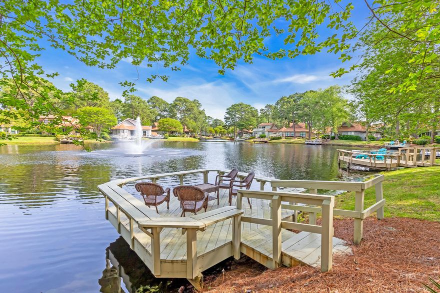 New Roof 2/14/2024. Nestled amidst Florida's breathtaking natural landscape, this charming 2-bedroom cottage offers an idyllic retreat like no other, now including the added luxury of a golf cart for your leisurely explorations. Whether you seek a cozy primary residence or an investment property, this cottage's serene ambiance, enhanced by the convenience of personal transportation, and prime location make it a versatile and appealing choice. Imagine unwinding on the expansive deck, serenaded by the gentle babble of a nearby fountain, all while soaking in the panoramic view of the shimmering lake. Alternatively, find tranquility in the screened-in porch, where the refreshing autumn breeze envelops you in comfort.