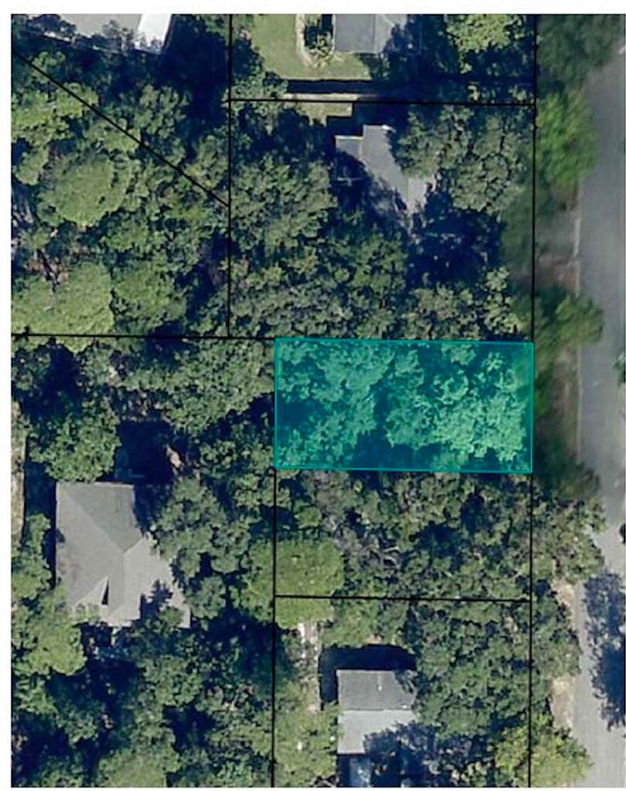 MASSIVE PRICE REDUCTION!! **MUST SEE*** Vacant lot zoned MULTI FAMILY or RESIDENTIAL (50x100ft).  Lot is in well established waterfront subdivision on south side of Highway 98 in Navarre, FL. It is  high, dry, X flood zone, No HOA, NO wetlands, and on sewer. The best part is that you have SOUND VIEWS (approx. 400' from Santa Rosa Sound;) and access to the Sound. Convenient to EVERYTHING such as great schools, shopping, groceries, military bases, medical, including famous, beautiful Navarre, FL beaches! Great schools!  Lot owner is also Florida State Certified General Contractor and can build to suit on this lot. Come See all the new, high end homes in the neighborhood and build your own!!