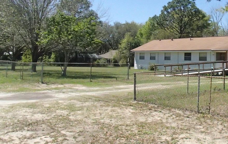 Level 0.91 acre parcel in Seminole (2 lots). According to Okaloosa County Growth Management parcel can be split into 3, possibly into 4 parcels. Buildings convey as is, value is in the land. Buyer to verify anything deemed important.