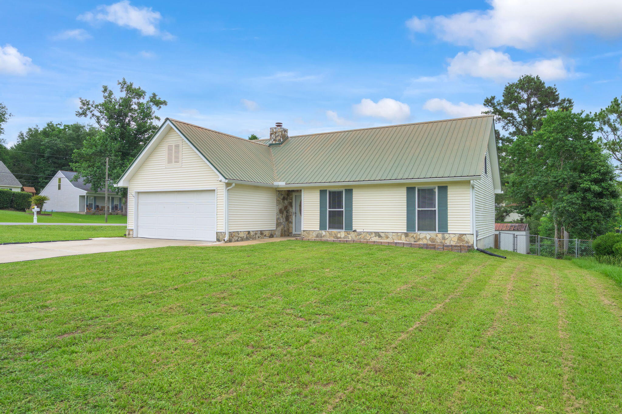 * $1 MOVE-IN for VA buyers & for FHA First-time Homebuyers, with approved credit & using preferred lender! * This well-maintained home, in a great location in south Crestview has a very small HOA fee of $84/year and low county property taxes! You'll enter the home into the foyer, then continue into the large living area with a rock-faced corner fireplace. The home has tile floors throughout & a large Florida room on the back side of the home. Updated master bath has a dual vanity and shiplap accent wall. 4th bedroom is upstairs and could make a great bonus room, mancave or theater room. The home has gutters with French drains & fenced back yard. HVAC, 2016. WH, 2019. Metal Roof, 2005 with plenty of life left. VA Assumable loan at 2.75% to those who qualify!