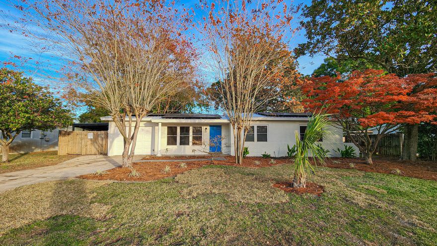 Beautifully renovated 3-bedroom, 2-bath residence offering refined comfort and modern elegance. A long driveway and welcoming front yard set the tone as you enter the expansive living and dining area, designed for both gracious entertaining and everyday living. The bright, white chef's kitchen showcases stainless steel appliances and a clean, timeless aesthetic. Just off the dining space, a stunning solarium provides a light-filled retreat ideal for a sophisticated family room or lounge. Enjoy outdoor living on the covered side patio featuring a built-in bar, with a spacious backyard complete with two storage sheds for added convenience. Ideally located less than 3 miles from Hurlburt Field AFB, this move-in-ready home blends upscale finishes with exceptional location. 