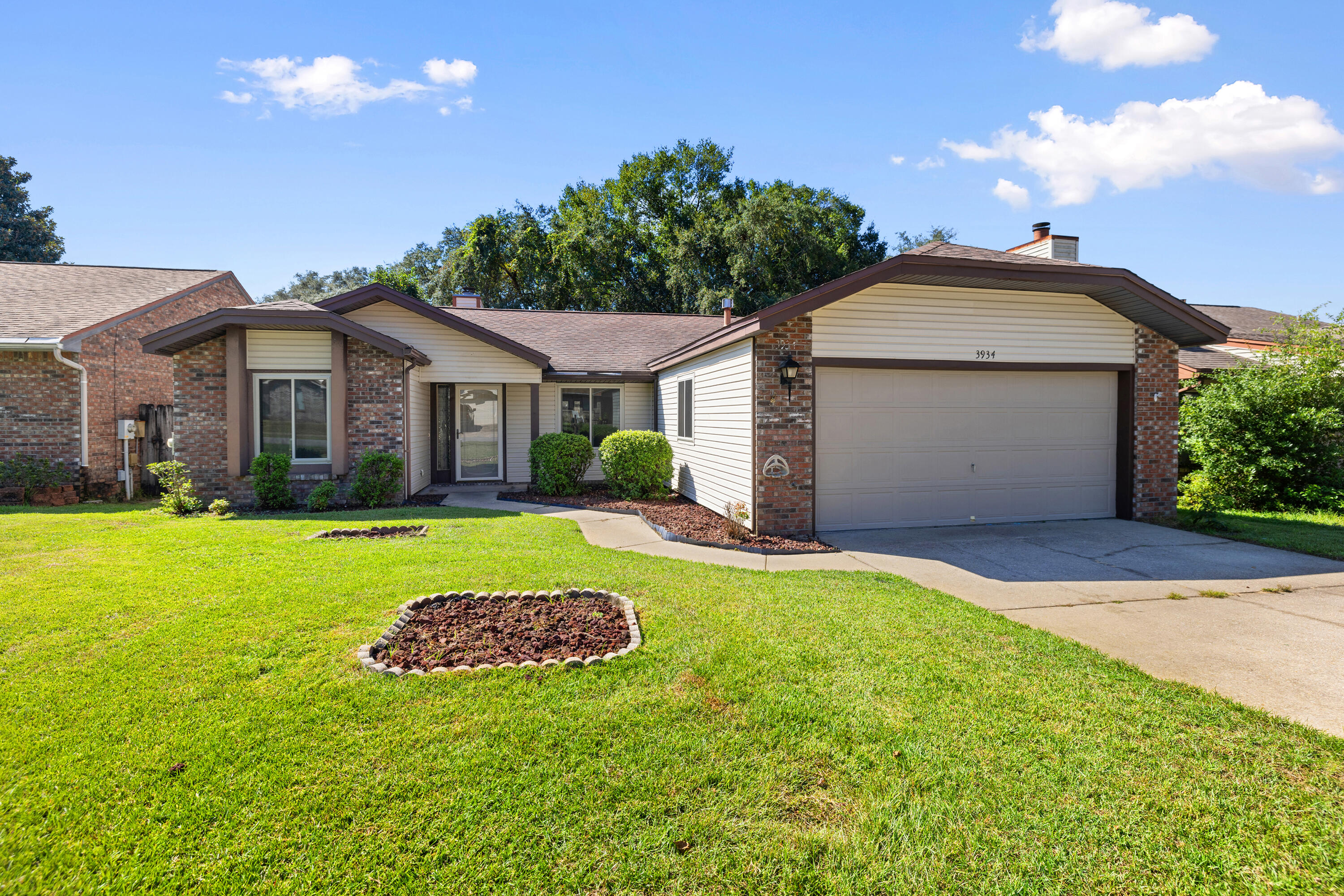 Welcome home to this fantastic single story ranch conveniently located in the Cedar Ridge neighborhood of Niceville! This home is within walking distance to the college, middle school, and high school and just a short drive to Eglin AFB and our beautiful beaches.This home features a desirable split floor plan, vaulted ceilings and fireplace in the Great Room, kitchen with breakfast nook and gas stove, all tile floors for easy clean up and maintenance, a heated and cooled light and bright spacious Florida room and a large deck off the back in the fenced yard for the kids and or fur-babies. You'll rest easy knowing it's got great bones including newer windows, HVAC 2017,  2015 water heater and solar panels paid in FULL.