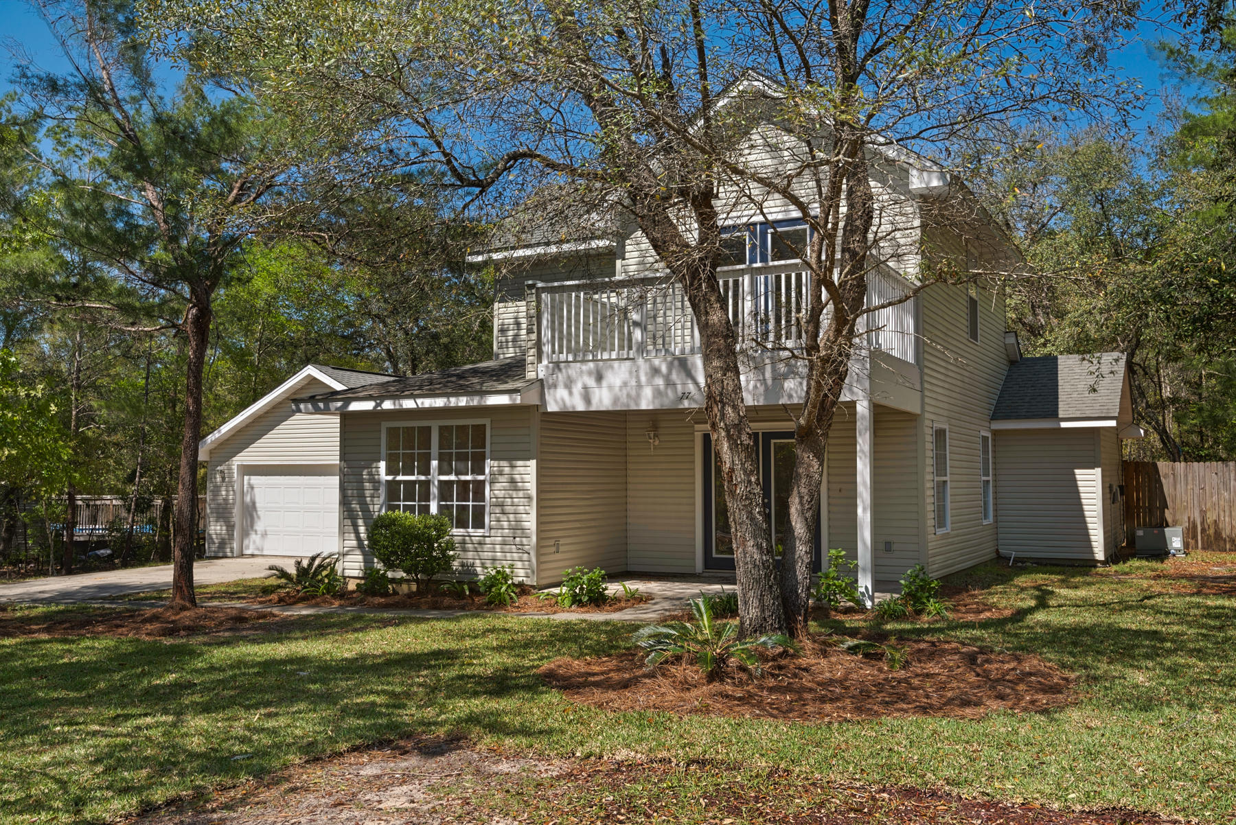 $4,000 toward Buyer CC! OPPORTUNITY KNOCKING! FABULOUS, Remodeled home for YOU! This 3 bedroom, 2 bath beauty is located situated on almost 1/2 acre lot (.448 acre) on quiet cul-de-sac located just before Hammock Bay. Split floor plan with two bedrooms on the first level and a Huge master suite with balcony on second floor. Master bath shower/tub combination. Stainless steel appliances, new granite counter tops (in kitchen and both bathrooms), and new carpet. Detached two-car garage with plenty of room for extra storage. Boat or RV? No problem! No association fees! Coming into spring and summer this back patio is perfect to host BBQ's and the fenced backyard with mature trees is natures playground for kids and pets. Buyer to verify all dimensions and information. Big on charm and value.