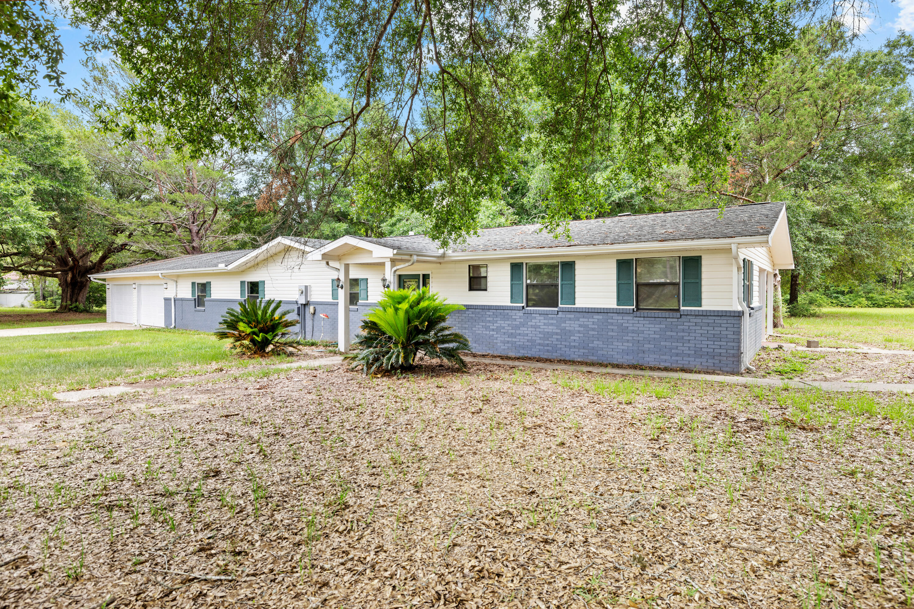 Short Sale Opportunity 4.43 acres south of I-10. The land is expansive and cleared, equipped with a chicken coop, barn, boosts beautiful mature oak trees and ready for whatever you can imagine. Perfect for horses and chickens! The home offers almost 2200 sq/ft of living space with 4 bedrooms and 3 full bathrooms. Each bedroom is spacious and offers ample closet space. So many possibilities with this home and its expansive land.
