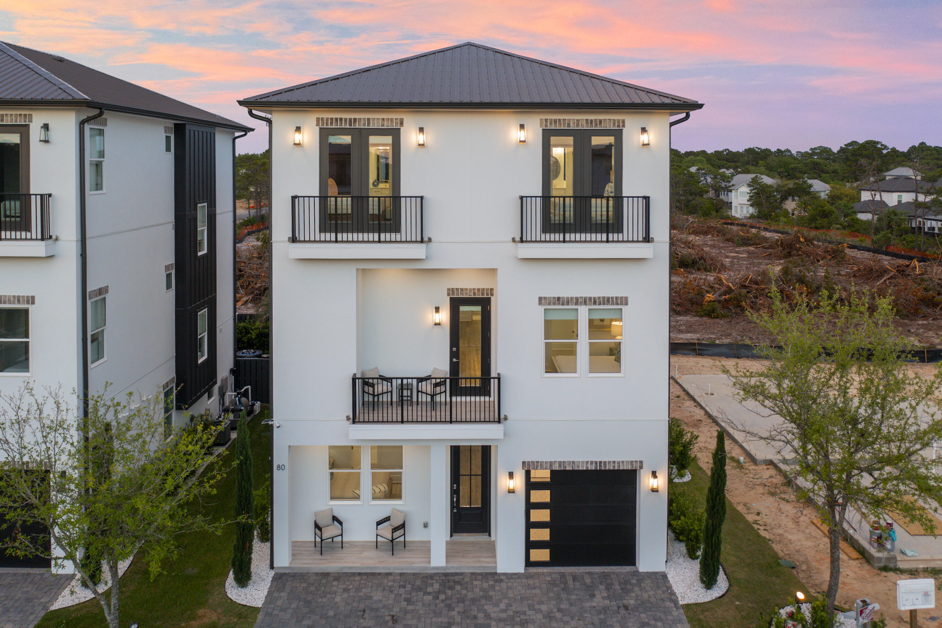 This new construction house is perfect for a vacation home. Great investment opportunity! This house is walking distance to the beach, restaurants, and shopping. This house has bedrooms on all 3 levels with en suite bathrooms, 2 Bunk rooms, owners storage area, private pool, outdoor kitchen, 1 car garage space, covered patio area with turf around pool area for less maintenance. Tankless water heaters, 66 in frig/ freezer Gas stove.  Security cameras, This house will be fully furnished and rental ready!  Rental projections available by request.