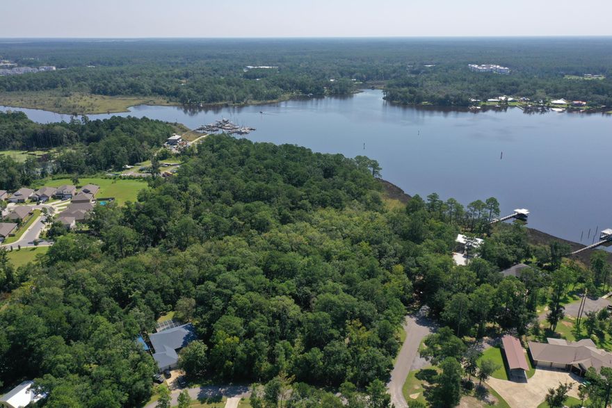 Discover the perfect opportunity to build your dream home on this 0.92-acre wooded lot located in the desirable Freeport area. Nestled among mature trees, this property offers privacy, natural beauty, and a serene setting just minutes from the water. With close proximity to Choctawhatchee Bay and only a short drive to the sugar-white beaches of South Walton, you can enjoy the best of both worlds--peaceful living and quick access to coastal amenities.This spacious lot provides ample room for a custom residence, outdoor living spaces, and more. Conveniently situated near schools, shopping, dining, and recreation, the property is ideal for those looking to invest in the rapidly growing Freeport community. No HOA restrictions provide flexibility for your future plans.