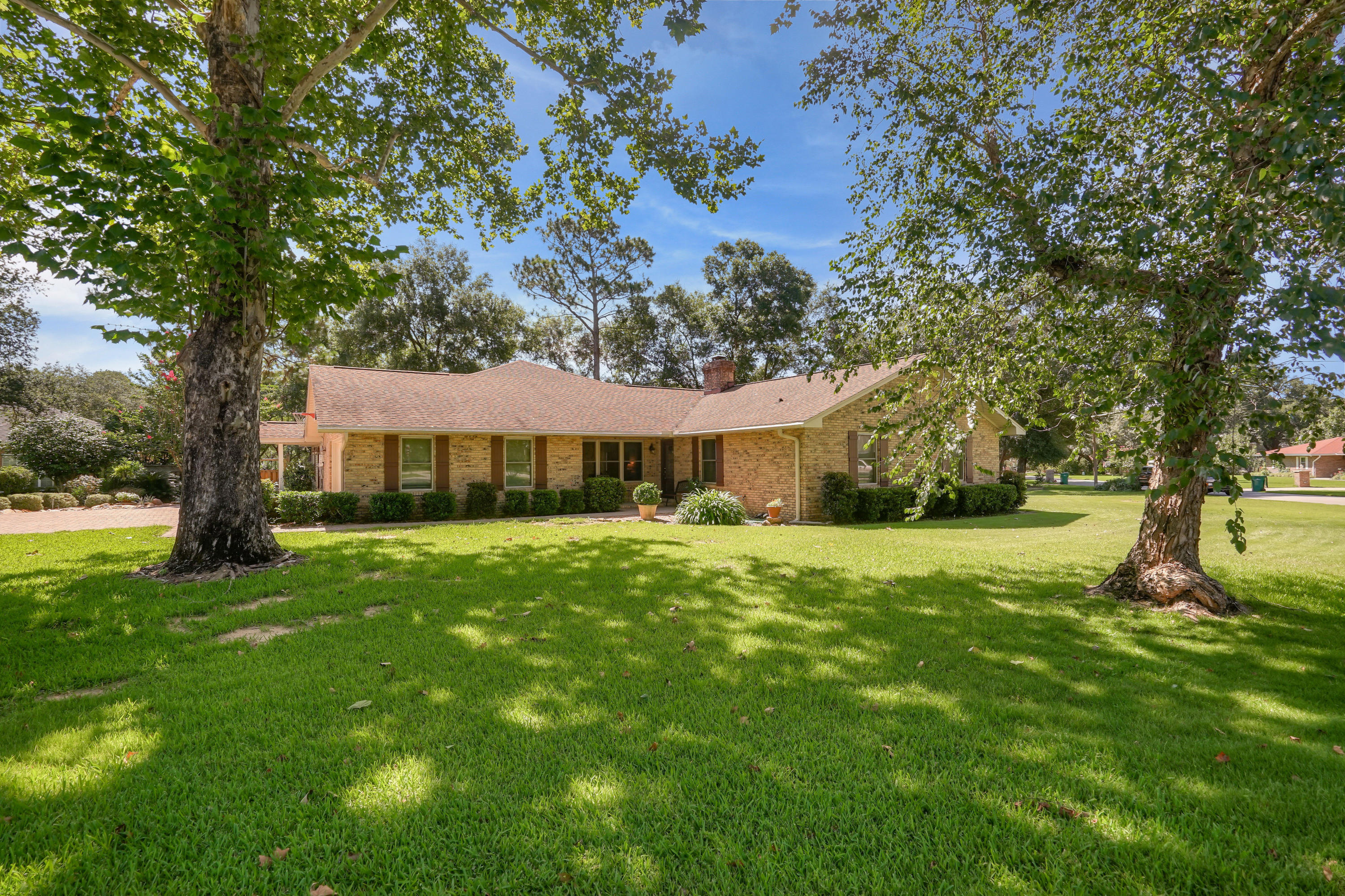 Beautiful home in Rocky Bayou. New roof in 2020. This home has a chef's kitchen with a dual fuel stove/oven and a beautiful marble island overlooking a large family room with a fireplace and 16 foot vaulted ceiling. Don't let the age of this home fool you, there have been numerous updates to include an addition built on in 2004 which includes a study currently being used as a 5th bedroom, a full bath with tiled shower and a large family room and screen porch with tall ceilings and cedar shake siding. It has brand new solar panels which will greatly reduce utility cost, a new paver driveway, the windows in the original part of the home were updated to hurricane certified windows, LED lighting, two HVAC systems, new garage door, all new exterior doors. There is a 10x10 shed out back.