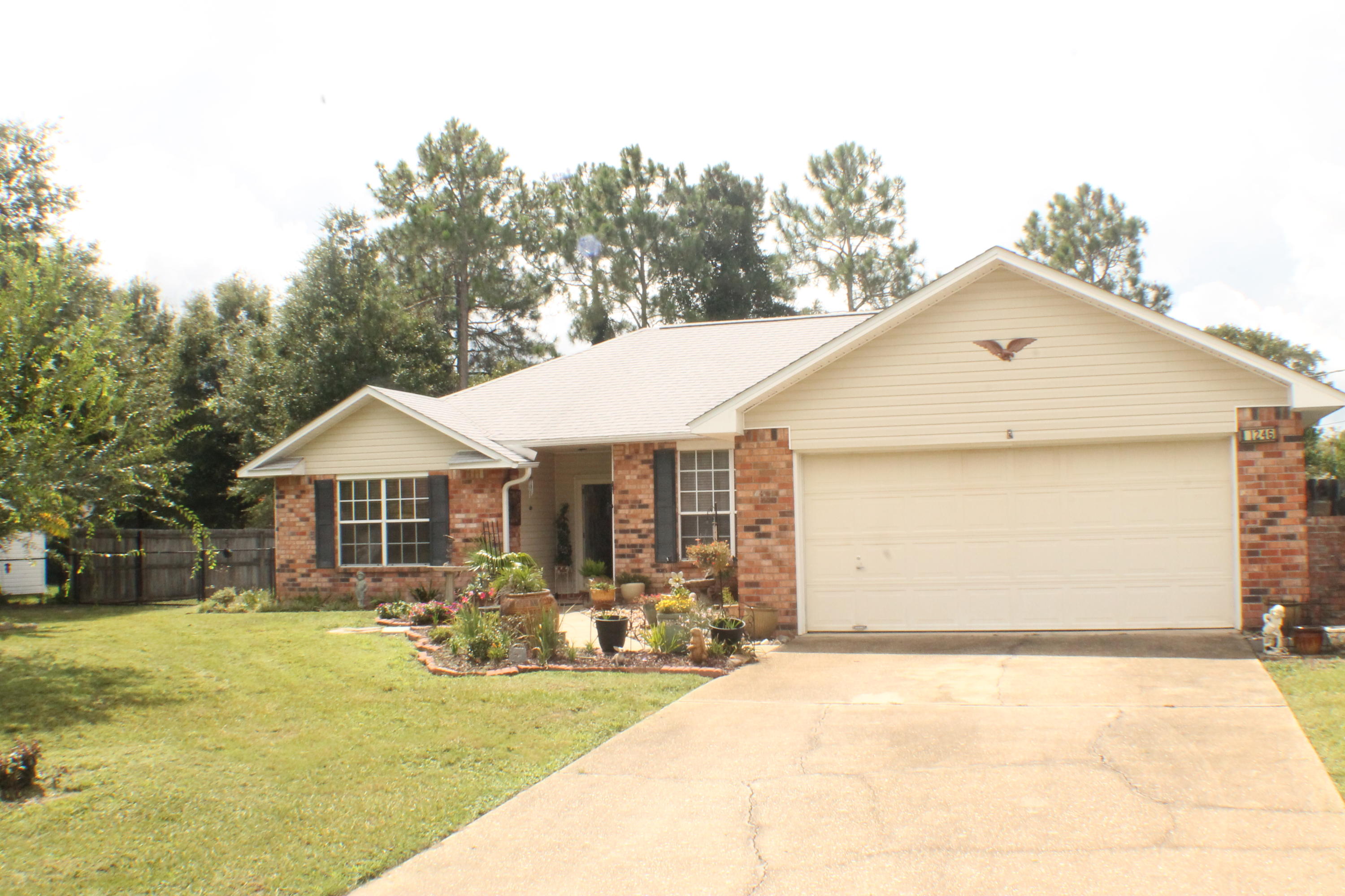 Just WOW! Great home located South of I-10 and near the bases, come take a look at this immaculate 3 bedroom 2 bath home with tons of curb appeal! This home has been designed for you the new buyer to step right in and begin making your memories. The screened in porch with dual fans creates a perfect place to relax or work or study. With 2 Storage Buildings and a 1/3 acre lot, making room for those outdoor improvement projects is made easy. A Gazebo which gives the opportunity for entertainment is nestled in on the property for your enjoyment. Make your appointment today to come make this home your New Home.