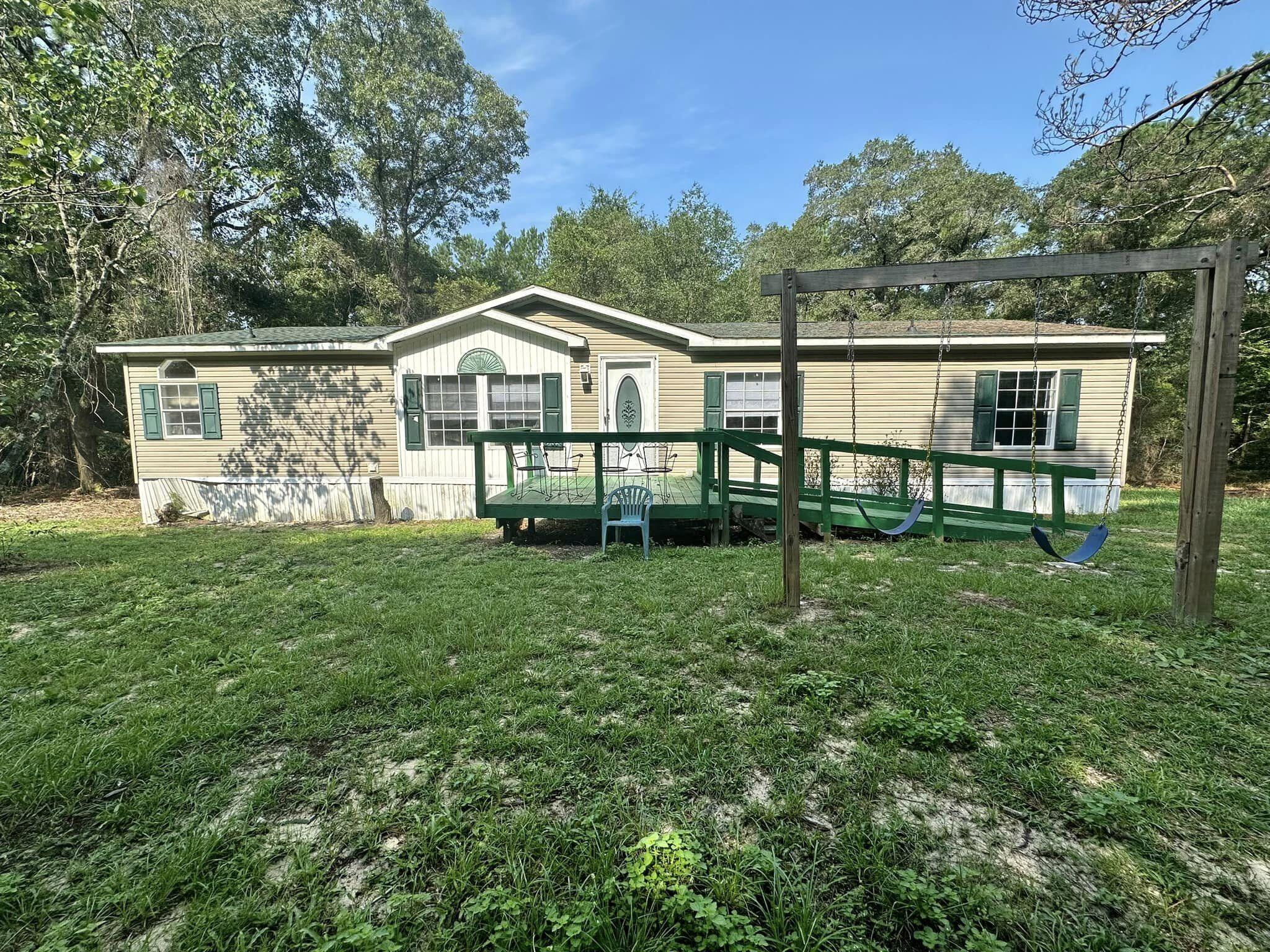 Ready to rent!!! Three bedrooms each with a walk in closet, two bathrooms and an open floor plan made for easy living tucked away in the woods but not far from town on two acres! Huge kitchen with ample cabinets and counter top space. Washer and Dryer included! Don't let this opportunity pass you by! Requirements are as follows- credit score of 600 or better, household income minimum of $3625, one year on the job unless you are moving here for an employment offer! Pets are case-by-case basis.