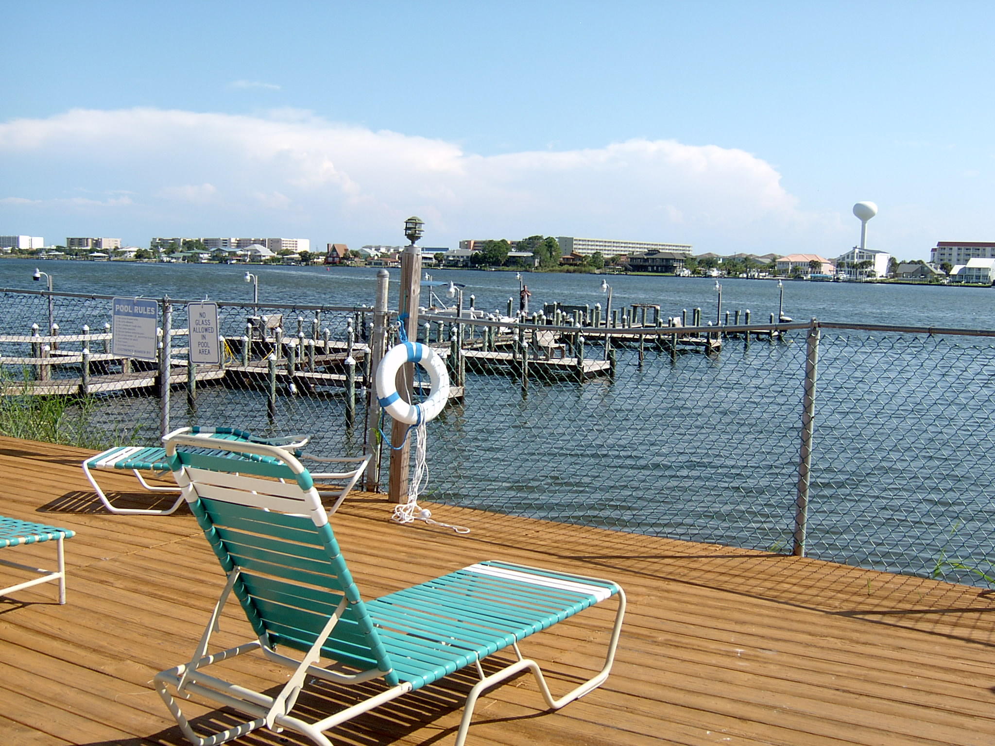 TWO BEDROOM, GROUND FLOOR UNIT WITH VIEWS OF TENNIS COURT, CLUBHOUSE AND INTERCOASTAL WATERWAY. PROJECT HAS BOAT DOCK, TENNIS, POOL OVERLOOKING INTERCOASTAL, PING PONG, POOL TABLE, BOOKS AND LARGE COMMUNITY ROOM WITH KITCHEN. MANAGMENT ON SITE, SECURITY CAMERAS. A GREAT PLACE TO LIVE.