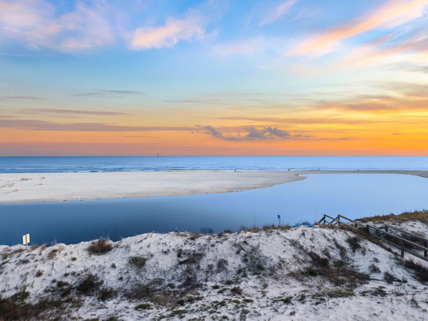 Presiding over serene dune, lake and gulf views, this quintessential beach house is in an exclusive private beach neighborhood. It comes with its own coveted Trex-plank walkover to the pristine white beach. Airy 12-ft. ceilings with dark wood beams enhance the great room, while the updated chef's kitchen boasts granite countertops, stainless appliances and an island with a cooktop. Perch on stools at the lengthy bar for casual dining and conversation. Tile floors and double-aspect windows invite you to a large screened porch with panoramic views extending across Draper Lake and the Gulf of Mexico. The oversized balcony on the second floor is perfect for laid-back entertaining and toasting sunsets from this enviable location. Four of the six bedrooms share the same breathtaking gulf views. This Gulf Front home is located in the sought-after, private beachfront, gated community of Old Florida Beach.  Old Florida Beach community is located south of 30A directly on a private beach, has heated community pool, Draper lake dock, and 3 community beach accesses. The established neighborhood makes it ideal for full-time residents or as a vacation rental.