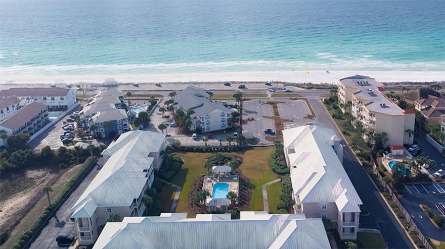 Enjoy this 3 bedroom, 3 bath condo, with a view of the Gulf of Mexico! This unit features hardwood floors in the living area and hall, stainless steel appliances and dark granite counter tops in the kitchen. Washer and dryer included in a large utility room. Two of the three bedrooms feature walk-in closets, and bathrooms with double-vanities, allowing access to the balcony. Step out onto the spacious wrap around balcony and enjoy a view of the pool, beautifully maintained grounds and a glimpse of the ocean. Small electric grills are allowed on balcony per HOA. No pets allowed. Water, Sewer, and Trash included in rent.