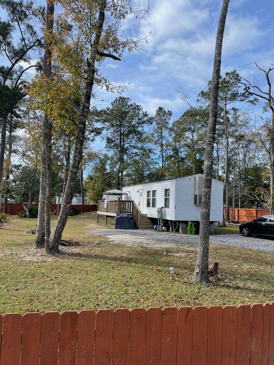 Great starter home on 1/4 acre lot,  80 X 150 foot with 2 bedroom, 1 bath, septic and city water. This property is currently rented at $900 per month. Serious inquiries only to see interior as there are renters in place. There are three other units available each at 85K.