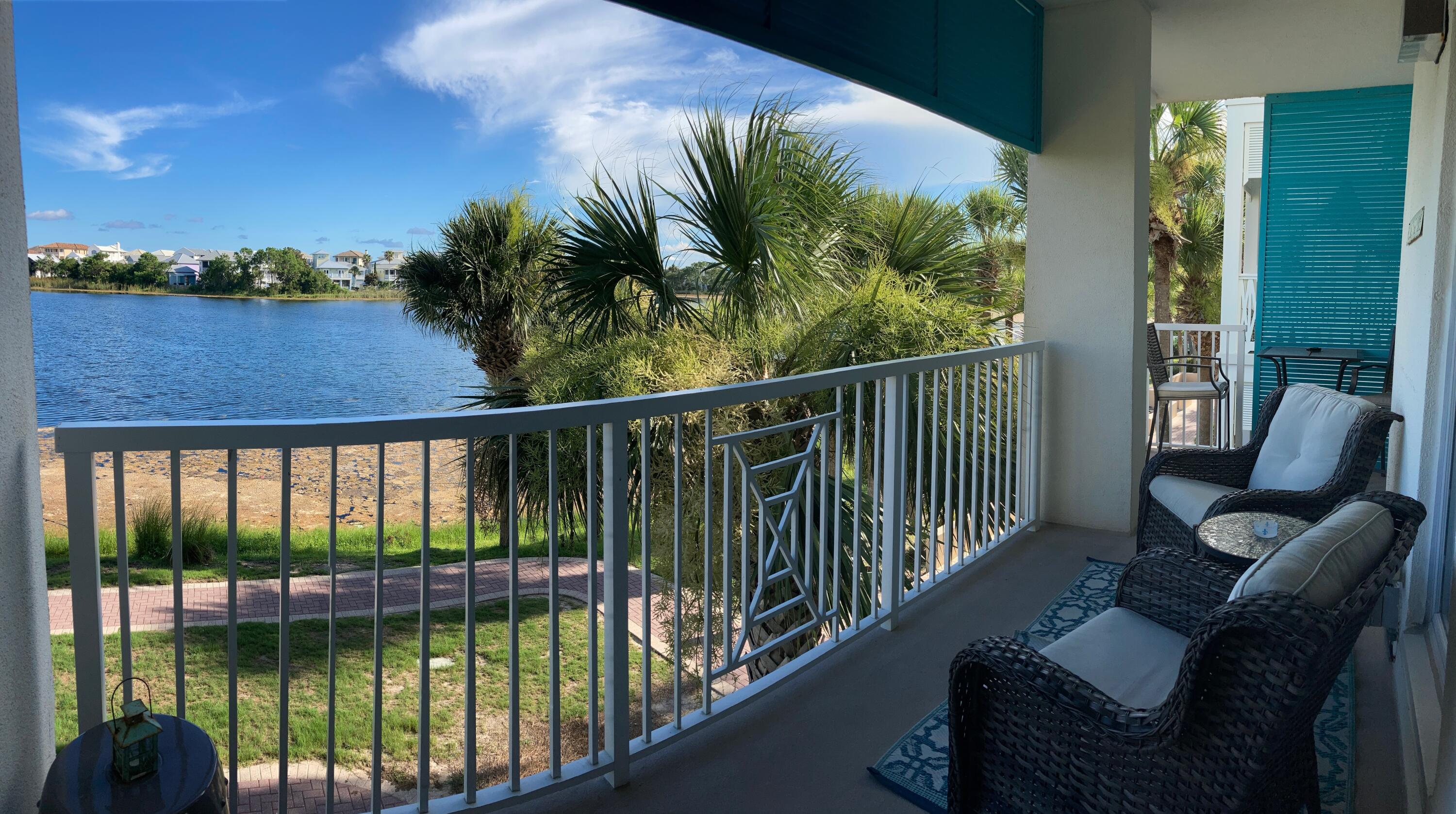 Breathtaking views from this lakefront unit! Investment Opportunity on this gorgeous larger private end unit providing great rental income. Unit 201 is updated with coastal luxury decor and a recent bathroom renovation. This condo is appointed with generous living space, a fireplace, 10 ft ceilings, 2 flatscreen TVs, LVP and tile flooring throughout, stainless steel appliances, granite countertops in the kitchen, and quartz countertops in the bath, tiled walk in shower, and newer furniture. Extra large wraparound balcony to enjoy the sunsets on the Gulf. Carillon Beach amenities include 3 pools, basketball and tennis courts, pickle ball, 8 deeded beach accesses, green spaces, fishing, bike and kayak rentals, restaurants, spa/salon, and Carillon Town Center.