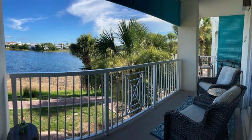 Breathtaking views from this lakefront unit! Investment Opportunity on this gorgeous larger private end unit providing great rental income. Unit 201 is updated with coastal luxury decor and a recent bathroom renovation. This condo is appointed with generous living space, a fireplace, 10 ft ceilings, 2 flatscreen TVs, LVP and tile flooring throughout, stainless steel appliances, granite countertops in the kitchen, and quartz countertops in the bath, tiled walk in shower, and newer furniture. Extra large wraparound balcony to enjoy the sunsets on the Gulf. Carillon Beach amenities include 3 pools, basketball and tennis courts, pickle ball, 8 deeded beach accesses, green spaces, fishing, bike and kayak rentals, restaurants, spa/salon, and Carillon Town Center.