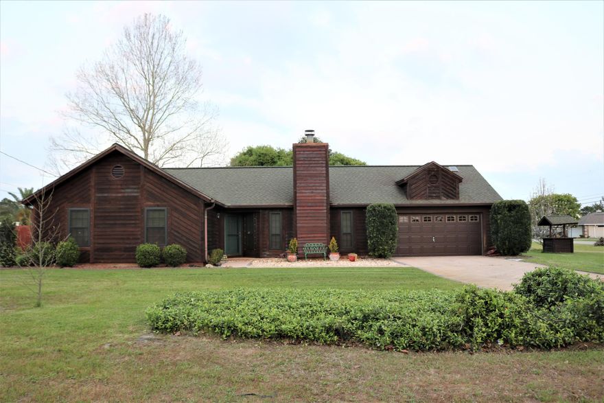 Move-in ready 3 bed 2 bath home on a large corner lot in Holley by the Sea for less than $225K! Enjoy all the amenities HBTS has to offer. Two separate 2-car garages top the feature list of this home. One facing the road, then a 2nd (permitted and HOA approved) full-sized garage has a single roll-up door facing the back yard. Previously used as a workshop with 220v, this would make an ideal entertainment space. Bring your pool table, dart board and stereo. The fully privacy fenced back yard has a double gate on Sandstone St., with a hard-packed drive leading to a large storage barn with 2 lofts. Plenty of parking for a boat, trailer, or RV. Interior has been professionally cleaned. Granite countertops in the kitchen and hall bath. Dual closets in master bedroom. New HVAC in 2015.