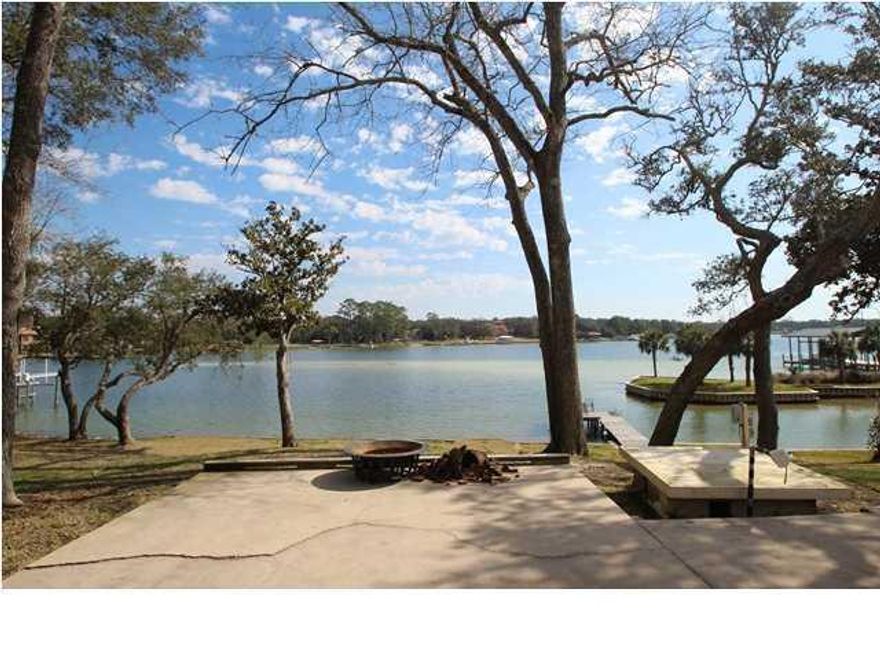 Short Sale. This incredible lot located in Poquito Bayou and on Hand's Cove is your chance to make waterfront living a reality. The two current structures on the property are offered As-Is but are very livable and offer an opportunity for affordable waterfront lifestyle. the two structures offer a total of 4 bedrooms and 4 baths. If a new home site is your wish you'll find few comparable to this one in today's market. The 102 by approx 320 lot offers so many options to make this homesite the waterfront homesite of your dreams. The seller says rumors are Al Capone had a home here on Hands Cove and that she and her sisters found a whiskey/shine still back in the 50s here. It's been in the family for over 50 years, it's time for your family to create their memories here.