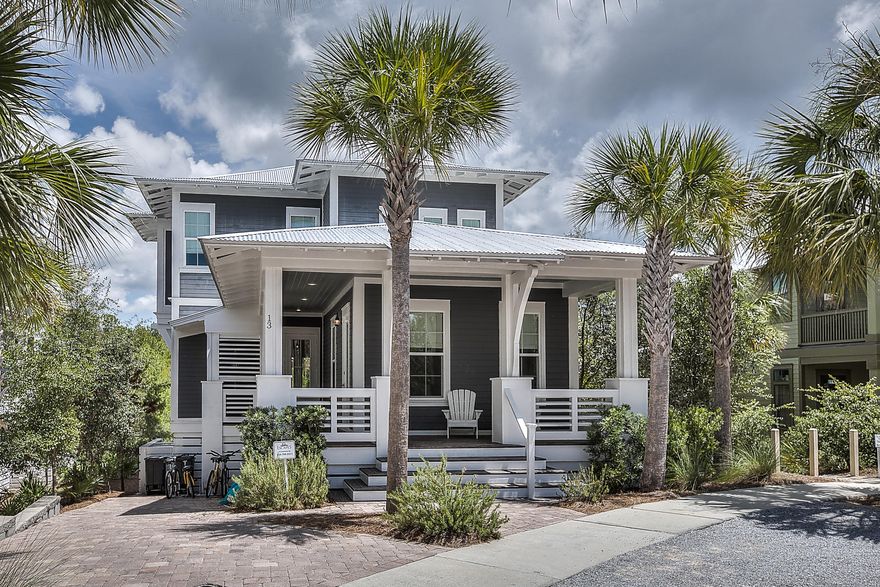 Greenway Loop is an upscale 4-bedroom home with accommodations for 8. It is designed for relaxation and located in the popular community of Seacrest Beach on beautiful Highway 30A. Luxury details include 10' ceilings, tile and wood floors throughout, designer furnishings, new comfortable mattresses, and an outdoor shower. The downstairs king bedroom is conveniently located off the foyer, and has access to a charming hall bath. The spacious living area along the rear of the home allows easy access to the screened balcony with bed swing, dining table, and green space views beyond. A large flat screen TV provides family entertainment for relaxing after a day of fun in the sun. The open and inviting kitchen is a chef's delight with custom cabinets, granite countertops, and stainless applia