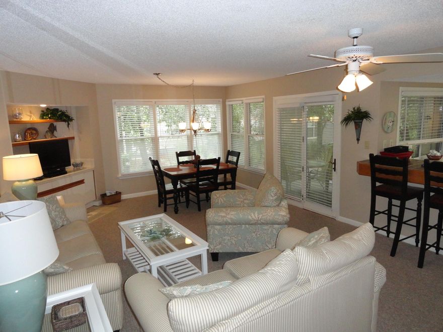 The calming dcor in neutral shades blended with comfortable furnishings seem to echo the peacefulness of the beaches.Plus, three porches offer ample space for appreciating the quiet woods snuggled against this Destin vacation condo.Upgrades like flat screen TVs throughout, a Jacuzzi tub in the master bathroom & original art & accoutrements add the finishing touches to this haven by the beach. A location so close to the shores of the Gulf is just the beginning of the perks that Hidden Dunes boasts.Sporting activities on site include bike racks, tennis courts, basketball & shuffleboard courts & for those who just want to sunbathe the two pools have plenty of lounge chairs.To top it all off, on the other side of scenic 98 is the nation's largest factory outlet, & is close to golf & dining