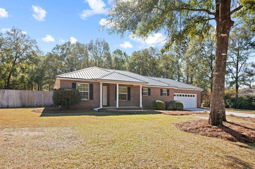 Escape to the tranquility of this beautiful  Key Lime built home situated on a lush 1-acre lot, in the sought after Hidden Springs subdivision. You will absolutely love the country setting of this home and all that it has to offer!!! Boasting a thoughtfully designed layout with brand new luxury vinyl plank flooring throughout the main living areas and bedrooms, and tile in bathrooms and laundry room.  NO CARPET! This home blends functionality and charm and truly offers everything you need and more. Trust me when I say that you will feel at home the moment you enter this lovely home. Featuring a spacious and airy floor plan filled with natural light, making it ideal for both relaxing and entertaining.  Master is located on one side with the additional bedrooms and full bath on the other. Spacious dining room and family room located off of the kitchen with a cozy corner fireplace. Kitchen with newer appliances and breakfast bar.  There are so many thoughtful touches throughout the home that add to its warmth and character while showing definite pride of ownership at the same time.  The amount of storage is very impressive!  There are extra closets galore, both inside the home and in the garage.  The garage is well thought out and EXCEPTIONAL by the way! French doors off of the family room lead to an outside patio that stretches across the back of home overlooking your absolutely breathtaking backyard!  With a sunsetter awning installed, this will be your true outdoor oasis.  The expansive yard provides plenty of space for outdoor activities, gardening, or simply enjoying the peace and quiet of rural living. If you love yardwork you will certainly love the outdoor shower in place for your convenience as well.  Last but certainly not least is a versatile yard building complete with electricity that would be perfect for a workshop, studio or just extra storage.  This home has been meticulously maintained and is an absolute must-see!  Come and experience the lifestyle you've been dreaming of! Significant items: Metal roof 2014, HVAC 2020, Water Heater 2018 and termite bond in place with Florida Pest Control.

