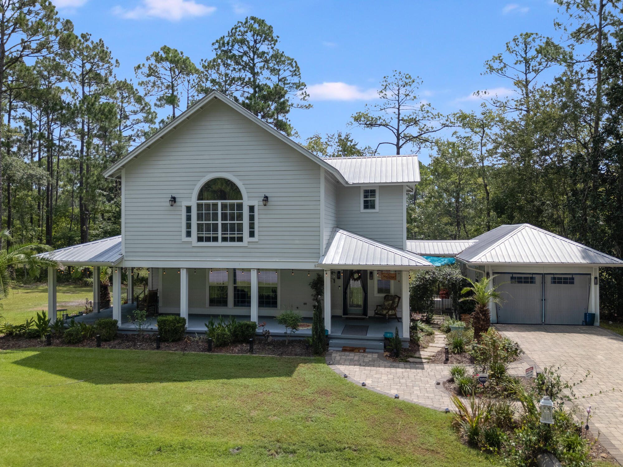 Welcome to your dream retreat .This stunning 3-bedroom, 3-bathroom home offers the perfect blend of natural beauty, luxurious living, and everyday practicality, with NO HOA fees.Step inside and be greeted by large windows that flood the home with natural light and offer breathtaking views of the surrounding trees and bayou. The spacious, open floor plan is designed for both relaxation and entertaining, featuring HUGE bedrooms, each with custom-designed closets and premium storage systems. At the heart of the home is a Tuscany-inspired gourmet kitchen, complete with granite countertops, high-end finishes. The kitchen flows seamlessly into the dining and living areas, creating a warm and inviting atmosphere. The primary suite is a true sanctuary, showcasing wall to wall beautiful white cabinets for ample storage, and direct access to a covered porch, perfect for enjoying quiet mornings or evening breezes. Outside, enjoy the peaceful surroundings with LaGrange Bayou as your backyard. Despite the private, nature-rich setting, you're just minutes from the world-famous beaches of the Emerald Coast, dining, shopping, and more. Schedule your tour today!