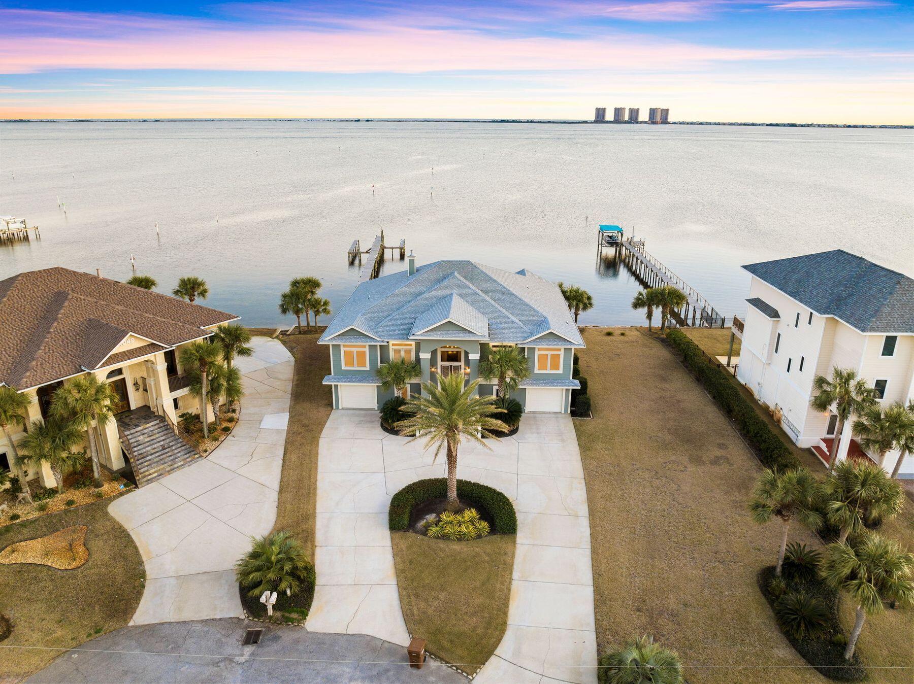 Presiding over stunning sound views, this magnificent property is beyond compare with 136 Feet of water front! A sweeping circular drive delivers you to the front door up a short flight of steps complete with a welcoming slate wall fountain. The main living space is all on the second level, taking full advantage of the waterfront location and uninterrupted views. The entire home is generously proportioned throughout, from oversized closets and soaring ceilings to the huge basement space. The wood-clad bar defines the open kitchen, which has sleek granite countertops and a stacked stone backsplash. Wellborn maple cabinets complement the quality appliances including a wine fridge.