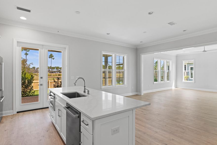 Discover refined coastal living in this thoughtfully designed new construction home in the Longleaf Park neighborhood of Watersound Origins. Built by Huff Homes, the Macy plan offers 5 bedrooms, 3.5 bathrooms, and 2,688 square feet of well-appointed living space. The open-concept first floor features luxury vinyl plank flooring throughout, a spacious living room, and a dining area perfect for entertaining. The gourmet kitchen is outfitted with upgraded Bosch gas appliances, including a vent hood and microwave drawer, quartz countertops, under-cabinet lighting, and a large center island for effortless gathering. The first-floor primary suite provides a serene retreat with a spacious ensuite bath and walk-in closet. Upstairs, an additional sitting room offers flexible living space ideal for a media room, home office, or play area along with four generously sized guest bedrooms. Outdoor living is a breeze thanks to the extended 11'x 24' screened rear porch with a calming water view and a gas grill stub, ready for your summer cookouts. This home also includes a 2-car garage and designer finishes throughout.
 
The Watersound Origins community offers an unparalleled lifestyle in South Walton  exceptional amenities, notoriously friendly and welcoming atmosphere, zero short-term rentals, and close proximity to all that 30A and Inlet Beach has to offer. Enjoy the zero-entry pool, playground, sports courts, and fitness center at the Village Commons, play a round of golf or foot golf at the Origins Golf Course, or take a walk along the many miles of walking and biking trails that wind all throughout the neighborhood! The new Watersound Town Center located at the entrance to the community (just a short bike ride away from Longleaf Park!) offers several fantastic dining options (casual and formal), medical services, Starbucks, Publix, a Pavilion that hosts events year round, and more!
