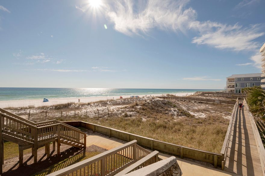 Amazing Views from this 1st Floor, 2BR/2BA, 1,208 SF Unit with steps down to the beach. Don't miss this amazing opportunity as a unit like this don't come up often.  This unit is fully furnished & rental ready.  It features gorgeous views from most every room and private walk down from the balcony to the beach.  The kitchen features granite countertops, crown molding with recessed accent lighting, shaker style cabinets and white appliances.  The living space has amazing views, new $11,000 sliding balcony doors, & access to the large balcony with beach access.  The master bedroom has balcony access, granite countertops, & travertine shower.  Other features include an additional bedroom, hallway full bath, & laundry closet.  See you at the Beach!