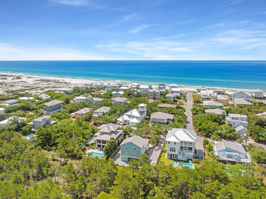 This classic beach cottage offers 2,520-sq.-ft of heated and cooled living space in the enviable neighborhood of Gulf Trace. Located between the beaches of Grayton and Blue Mountain, this community is nestled in a wooded wonderland that borders Grayton Beach State Park on three sizes and offers two neighborhood beach accesses. Featuring four beds and four-and-a-half baths, the property offers a private swimming pool, palm tree-ensconced patio, and a covered veranda for al fresco dining and outdoor cooking. Inside the home, the great room is cozy and inviting with cathedral ceilings and a fireplace. The kitchen is outfitted with stainless steel appliances and granite countertops providing both breakfast bar and dining table seating. The main living floor hosts the owner's suite with a