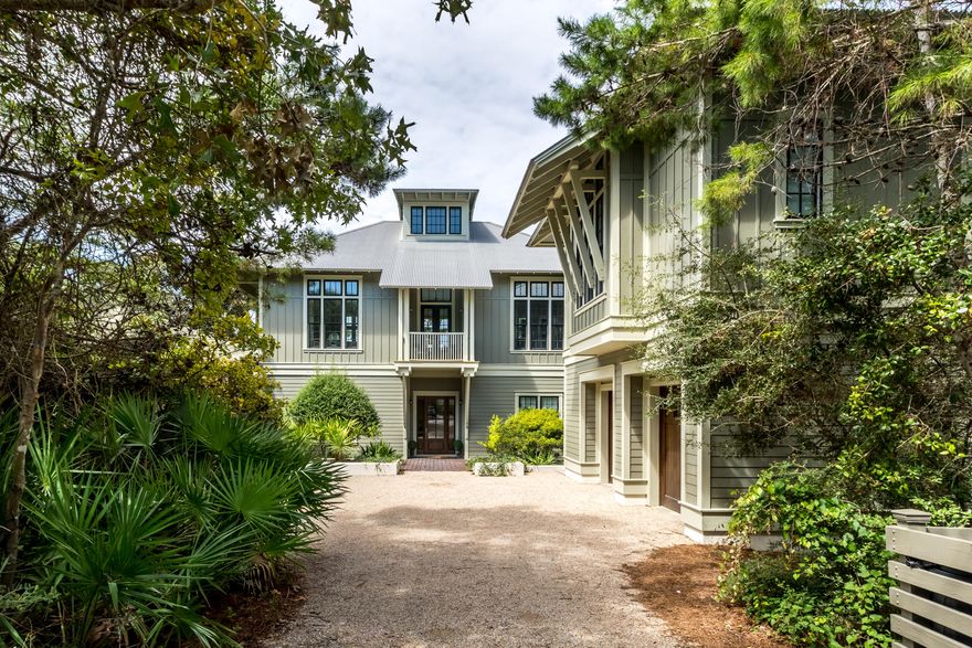 Sophisticated refinement defines this exemplary Watercolor Estate with prime location just steps from Seaside and the newly renovated Watercolor Beach Club. Located on coveted Dandelion Drive, this Phase 1, fine corner setting offers a rare quarter of an acre of exclusivity, with the ultimate gift of privacy and peeks of Western Lake. This stately residence with tremendous architectural significance promptly welcomes you upon first entrance. An entertainment-sized open concept living area and gourmet kitchen, includes 12 foot ceilings and access to 3 outdoor porches. All bedrooms with ensuite baths and a spacious multi-purpose room are all conveniently located on a single level. This home offers one of the largest carriage homes in Watercolor, including...
