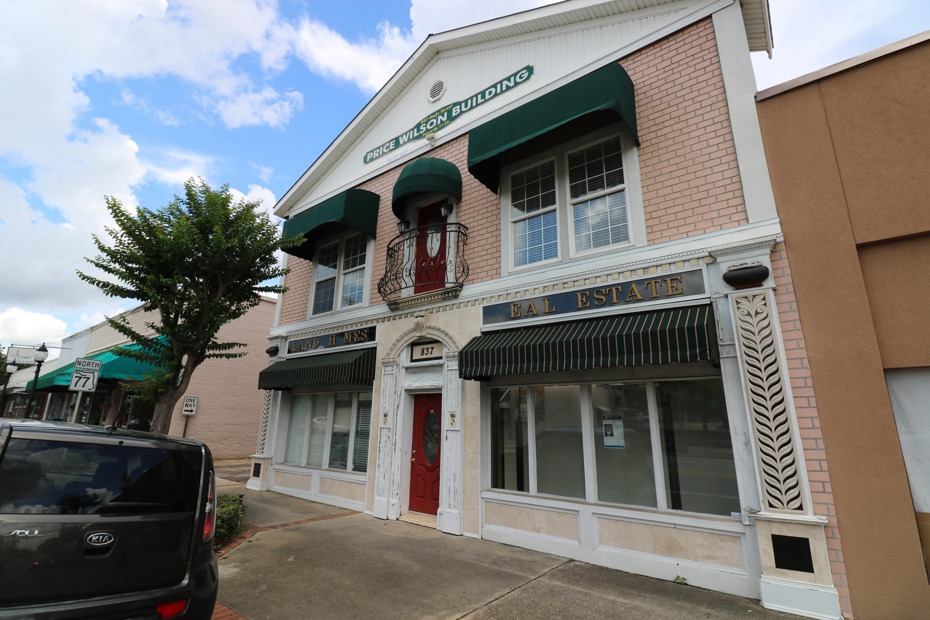 GREAT PRICE for this downtown commercial/residential building with upstairs loft living! Building is set up for 3 separate units but could be more. New and updated electrical, windows, doors, etc. 3500 sq ft with a bathroom in each unit.Roof is less than 6 yrs old. Nice flooring throughout-engineered hardwood, bamboo, and tile floors.This property qualifies for several historical improvement/renovation grants. The owner can live upstairs or because of the recent approval of downtown living, with fire code qualifications met, they can rent out the upstairs for tenant living spaces! There is a bathroom in each unit and a full kitchen upstairs. 2 HVAC units. Great location only 2.5 miles to Interstate 10 and within approximately 45 miles to the international airport and sugar white beaches.. ...Panama City Beach. New water heater(220 power). Awnings were made for 12K in Orlando by Disney supplier. Non flammable materials. All downstairs floor joists and boards are new. The building exterior walls are newly sealed and stucco'd..