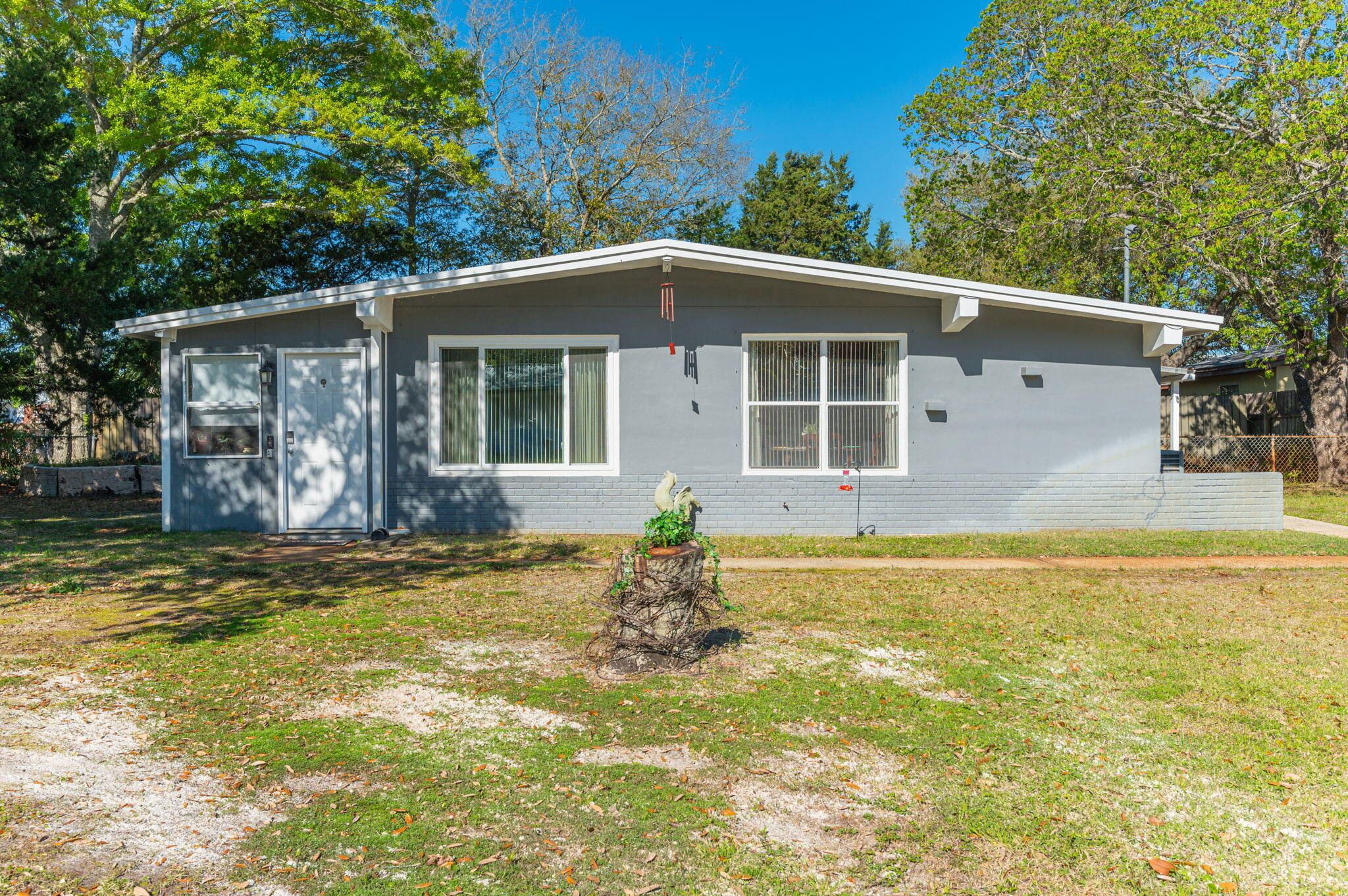 Seller is offering $5,000 closing credit with acceptable offer!!! This well maintained block home is a must see that is conveniently located to all things Fort Walton, local military bases, and only 4 miles from the Okaloosa Island Pier/beach and 9 miles to the Destin Harbor. Inside the home a few of my favorite features include the charming semi open floor plan that makes a great space for the family and friends, the country kitchen, and large windows on the front of the home for natural light. Outside is sure to impress as well with the fully finished workshop which includes a great storage loft, a fenced in back yard, irrigation, and a covered patio to name a few. To top things off a new roof, a hurricane window in the living room, and hurricane fabric shields were installed in 2023