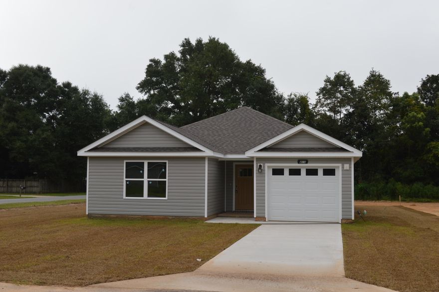 Great new construction home in the heart of Crestview...complete by the end of September.  Quality construction by one of Northwest Florida's most conscientious builders!  Home features 3 bedrooms and 2 baths -  galley kitchen with rich dark cabinetry - breakfast area - roomy living area - luxury vinyl plank flooring in the common areas - carpet in the bedrooms - covered porch and expanded patio - corner lot.  Nothing beats new and this one will be finished soon so don't miss out!  Interior pictures are of an identical plan built earlier this year.  Buyer to satisfy themselves with all information they deem important.