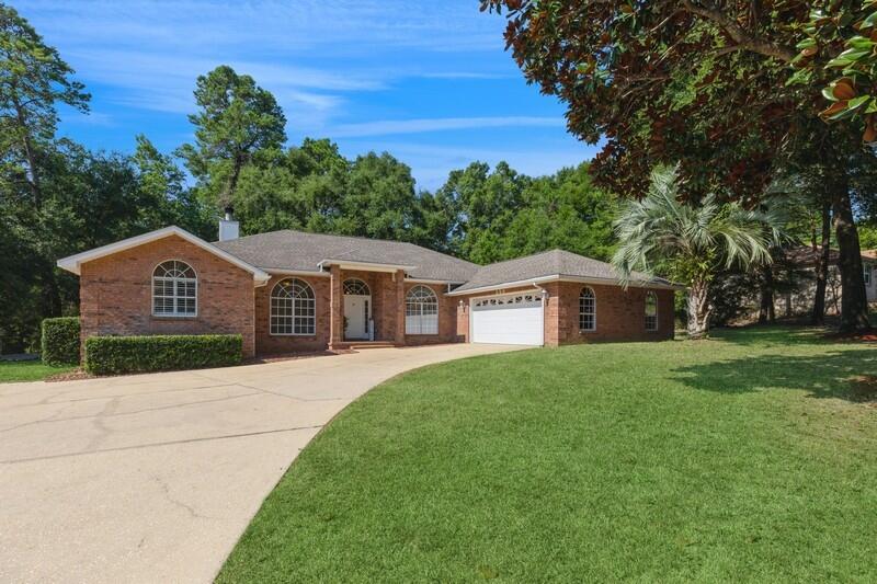 Sellers willing to assist with closing costs! This lovely brick home while located in the highly desirable Rocky Bayou Country Club Estates has NO HOA! This move-in ready brick home offers approximately 2,486 square feet of heated and cooled space and a view of Lake Henderson. The property features four bedrooms, allowing flexibility. The primary bedroom boasts two closets, including a spacious walk-in, offering ample storage. The ensuite primary bathroom showcases separate vanities, a large jetted spa tub, and a separate shower, creating a spa-like retreat.The kitchen is generously sized and equipped with granite countertops and stainless-steel appliances, catering to the culinary enthusiast. The open-concept floor plan seamlessly integrates the kitchen with the family room,