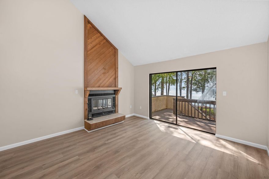 Enjoy stunning water views from all three levels of this beautifully updated 2-bedroom, 3-bath home. Featuring fresh paint, crisp trim, and luxury vinyl plank flooring throughout, this residence combines comfort and coastal style.The renovated kitchen offers stainless steel appliances and a bright, open feel perfect for entertaining. The spacious living area includes a wood-burning fireplace, soaring multi-level vaulted ceilings, and access to a screened-in patio overlooking the water. The primary suite boasts a vaulted ceiling, walk-in closet, dual sinks with an extra-long vanity, and a separate water closet with a walk-in shower enclosed in glass. A second bedroom and full bath with a shower-tub combo provide plenty of space for guests, while a full bath on the main level adds convenience.
Additional highlights include a single-car garage with extra storage and access to Bluewater Bay amenities  including walking trails and marina access. Experience the best of waterfront living in one of Niceville's most desirable neighborhoods! Contact us today for a showing!