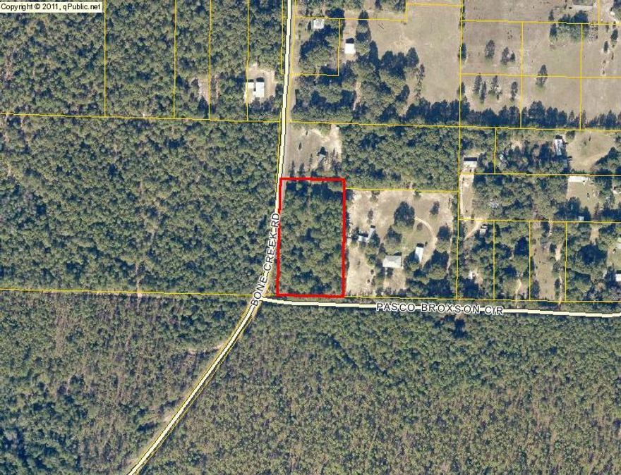 Wooded lot in Holt at the corner of Pasco Broxson Circle and Bone Creek Road. Large large that ensures maximum privacy for your new country home. Seller reserves mineral rights.