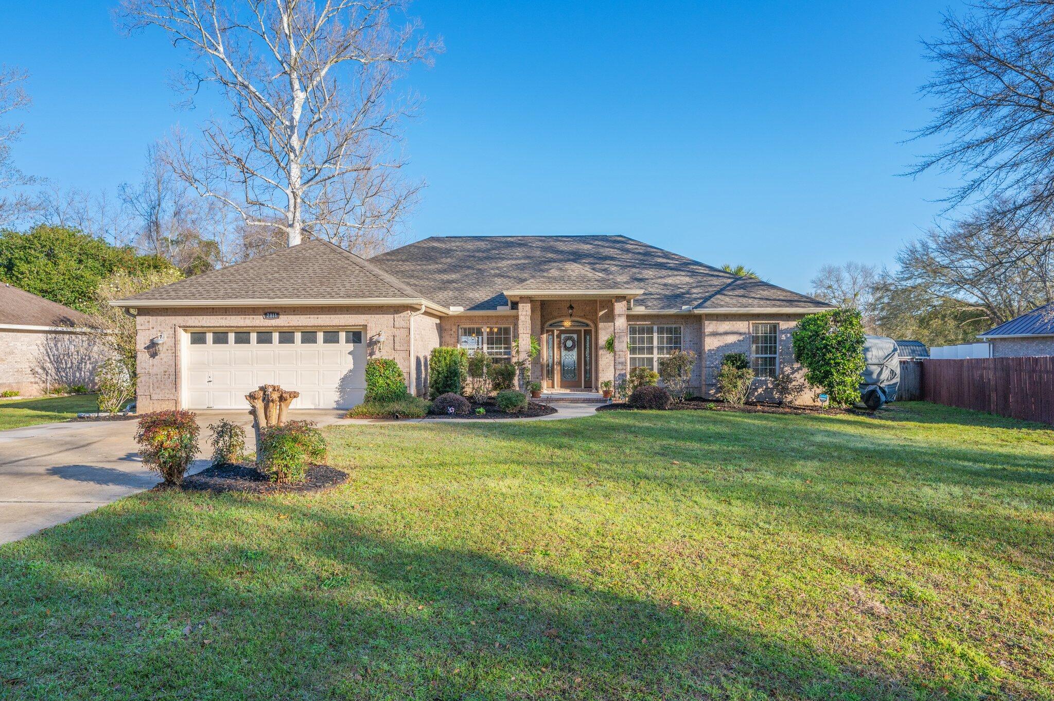 **2.375% Assumable VA Loan Option**Stunning Saltwater Pool Home on a Half-Acre Lot in North Crestview!This award-winning home, a 2006 Parade of Homes winner, offers a spacious and beautifully designed layout. Featuring 4 bedrooms, 2 baths, and an expansive 2,400+ sq. ft. of living space, this home is perfect for both relaxing and entertaining.The large family room welcomes you with an open, airy feel, while the formal dining room and cozy breakfast nook provide ideal spaces for meals and gatherings. The chef's kitchen boasts stainless steel appliances, granite countertops, and a convenient breakfast bar, with a huge pantry offering plenty of storage.The front bedroom, which could easily function as an office or hobby room, provides added versatility. The master suite is a true retreat, with a tray ceiling, crown molding, and direct access to the pool area. The custom-built master closet offers ample space, and the en-suite master bath features a separate shower, jetted garden tub, and dual vanities for ultimate comfort.
Step outside into your private backyard oasis, complete with a sparkling in-ground saltwater pool, lush landscaping, and a full-yard sprinkler system. The yard also includes fruit trees, adding charm and beauty to the setting.
