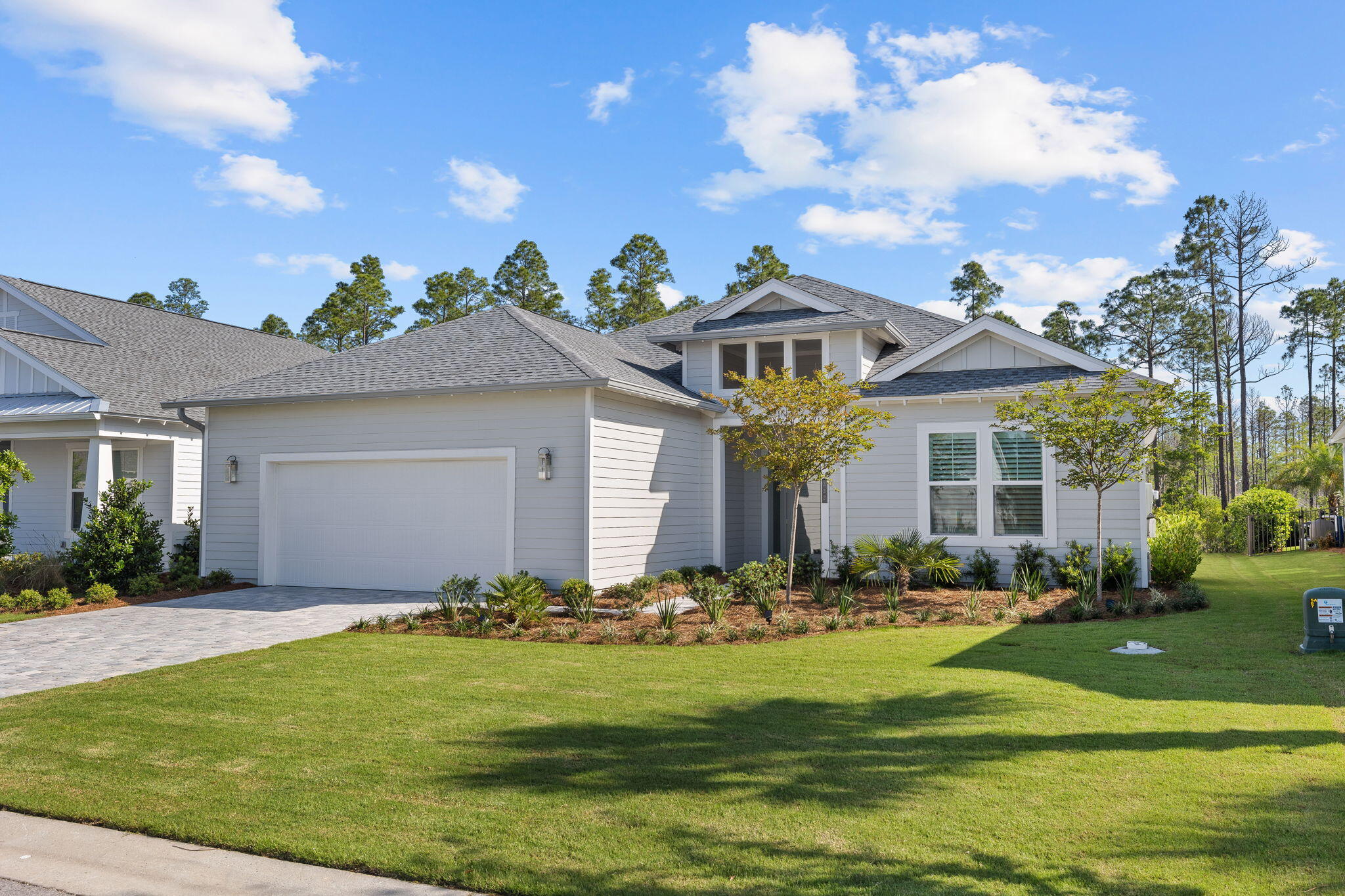 Currently under contact with contingencies.  72 hour kick out clause in effect, call Listing Agent with inquiries. Entertainers Dream in Inlet Beach!  Come join the Watersound Origins community with this furnished gem filled with upgrades. This 3 Bed/3 Bath exquisite home was built in 2023 and features many upgrades.  Follow the stone drive up to the entryway and prepare to be wowed by statement wall in the foyer and the spacious floor plan that opens before you.  As you walk into the living area you will notice the oversized dining room and the living room complete with a marble TV surround.  Between the kitchen and dining room, there is seating for 20 and the doors in the living room open accordion style to reveal the extended lanai with its own outdoor kitchen!