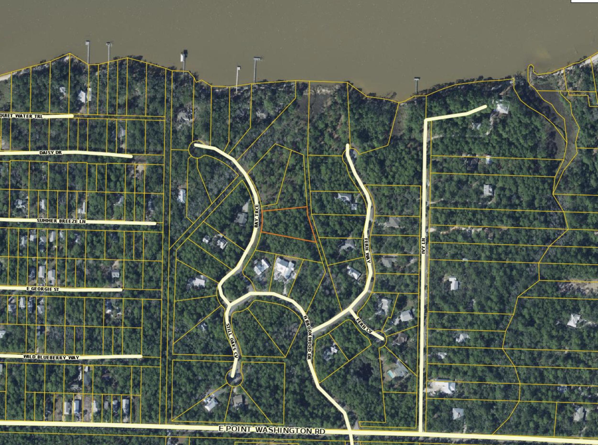 Large wooded .83 acre homesite in The Woods subdivision of Point Washington. This homesite backs to a natural preserve space and potentially has bay views from a future home. This neighborhood has a community dock on the Choctawhatchee Bay where neighbors can launch kayaks and paddle boards, fish, or enjoy a beautiful sunset over the water. This beautiful homesite is only 5 miles to the beach, restaurants and shops along Scenic Highway 30-A.